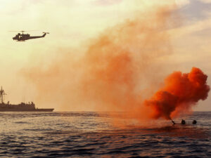 Boater with flare being rescued